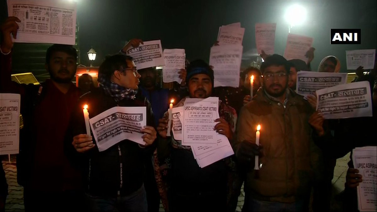 ANI's tweet photo. Delhi: UPSC aspirants stage protest outside BJP President Amit Shah's residence demanding compensatory attempts in UPSC Civil Services Exam for those who suffered due to the Civil Services Aptitude Test (CSAT) exam pattern https://t.co/BgWeDO4aLu