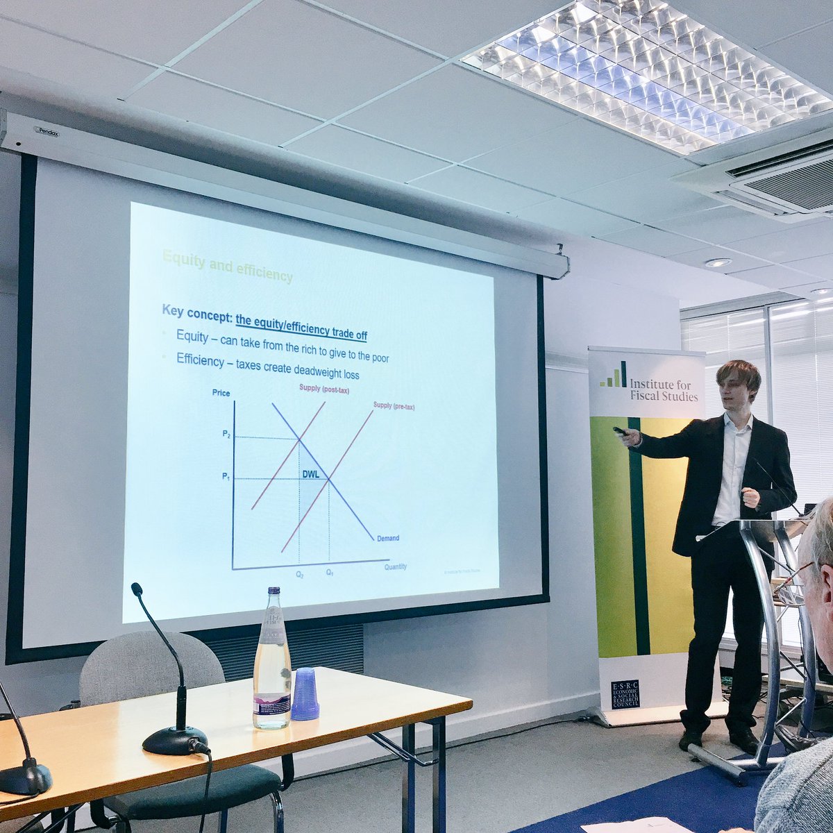 Tom Waters opens IFS public economics lecture by explaining the #equityefficiency #tradeoff of taxes #deadweightloss @uw_wbs #economics #publiceconomics #publicpolicy