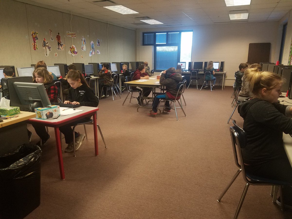 Students working hard typing up their New Year's Resolutions for school, family, and personal growth 🎉