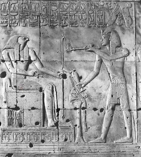 Sethos I offers incense and a libation to the enthroned Sokar. 19th dynasty. Temple of Sethos I, Abydos.