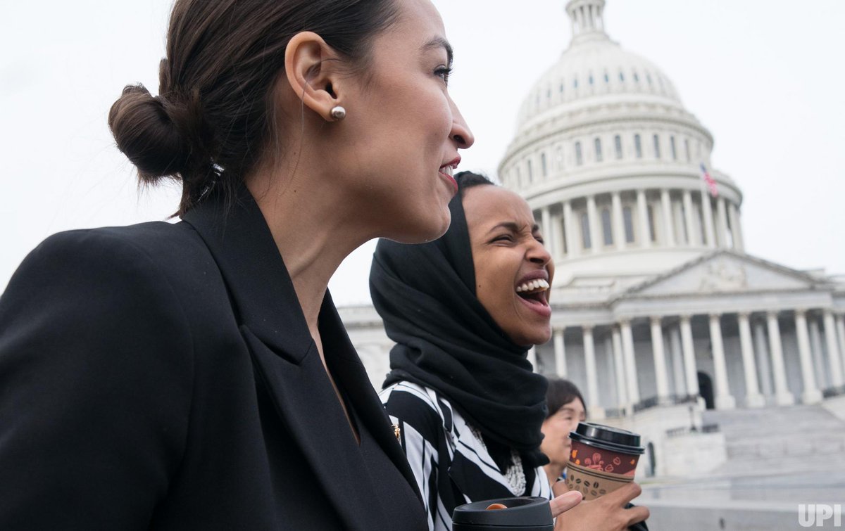 Rep. Alexandria Ocasio-Cortez @AOC, D-NY, walks with Rep. Ilhan Omar @IlhanMN, D-MN, as the two make their way to a group photo of the female #HouseDemocrats for the #116thCongress at the U.S. Capitol on Jan. 3, 2019. Photo by Kevin Dietsch for @UPI.