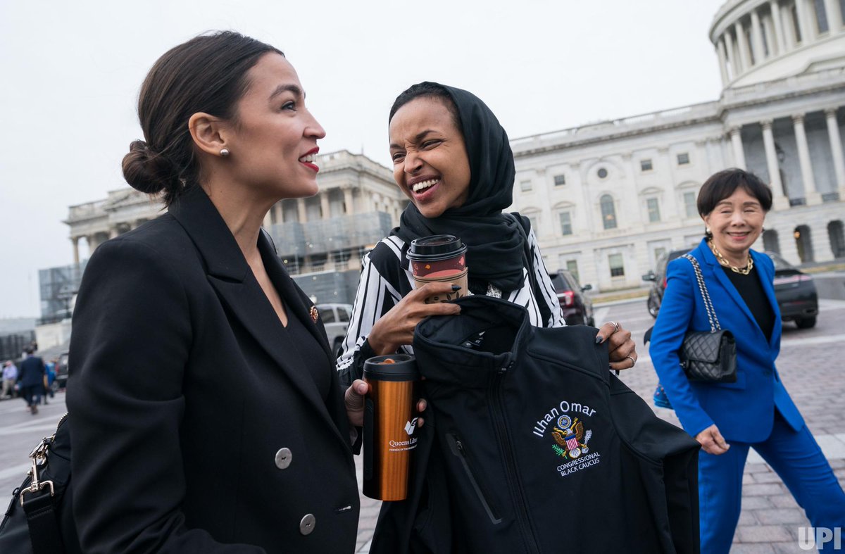 Rep. Alexandria Ocasio-Cortez @AOC, D-NY, walks with Rep. Ilhan Omar @IlhanMN, D-MN, as the two make their way to a group photo of the female #HouseDemocrats for the #116thCongress at the U.S. Capitol on Jan. 3, 2019. Photo by Kevin Dietsch for @UPI.