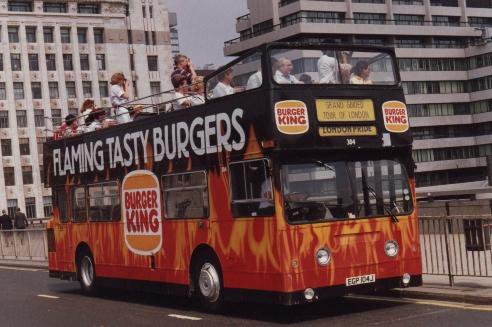 Open top bus covered in Burger King adverts