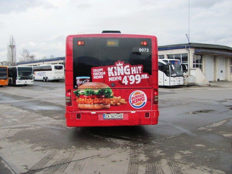 Back of bus with prominent Burger King advert 