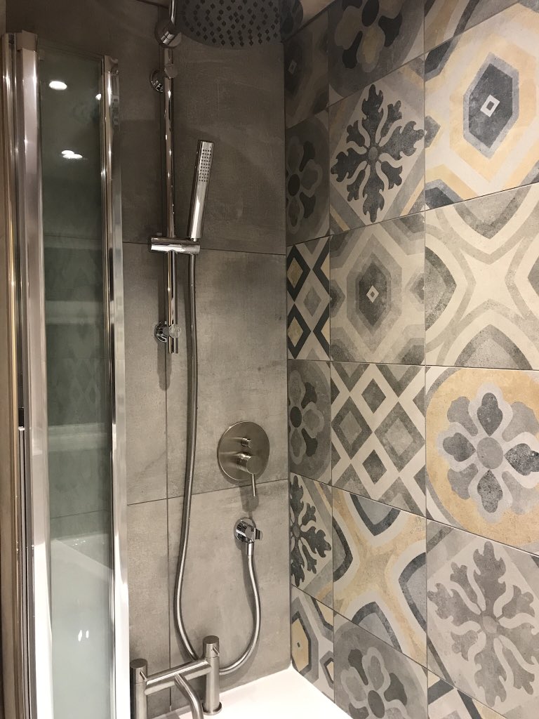 Sheffplumb's tweet photo. Bathroom supply and installation, this client wanted the modern trend of concrete complemented with patch work tiles by #rakceramics and a brown plank effect floor tiles, space saving shower screen, nickel brassware #bathroom #bathroomdesign #SheffieldisSuper #sheffieldhelp https://t.co/E3T6CWKpPo