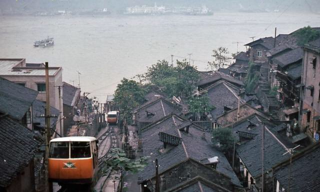 Public transportation of Chongqing in 1980s. tram, bus powered by natural gas bag on top, steam engine train! This was my memory of China when growing up there.