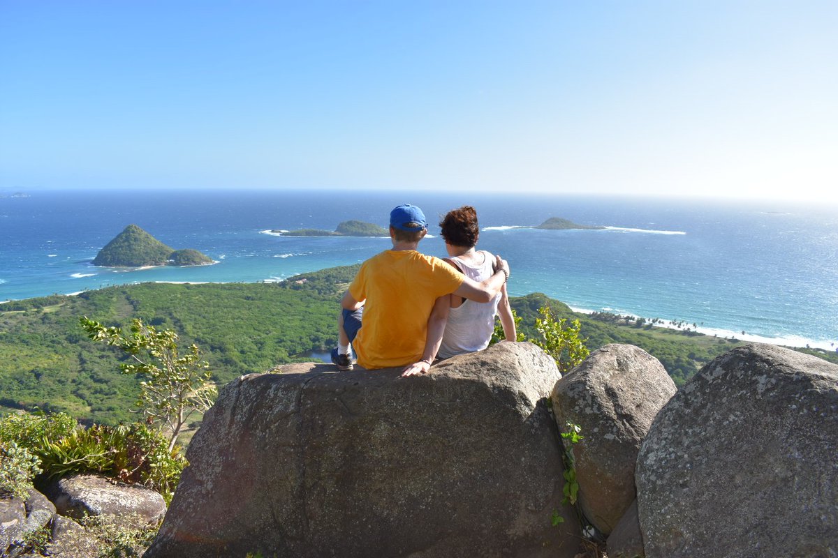 roamingspices's tweet photo. Enjoying the magical view over Sugarloaf, Green Island and Sandy Island from the Welcome Stone. #welcomestone #piton #stpatricksparish #Grenada #bathway https://t.co/6eAofnVGi7