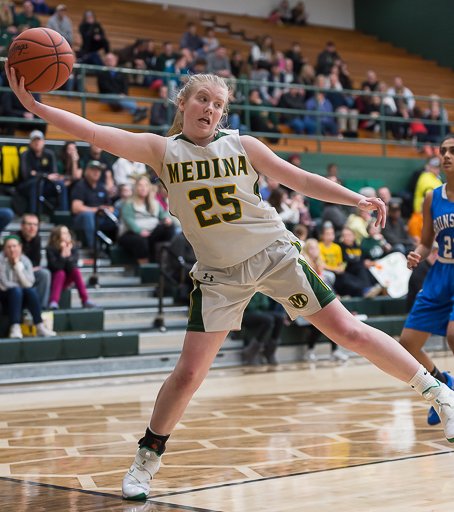 Medina's Maddi Rath just can't quite stay in bounds while retrieving a loose ball. <a href="/medinagbball/">Medina Girls Bball</a> <a href="/Miss_Sebera/">Miss Sebera</a>