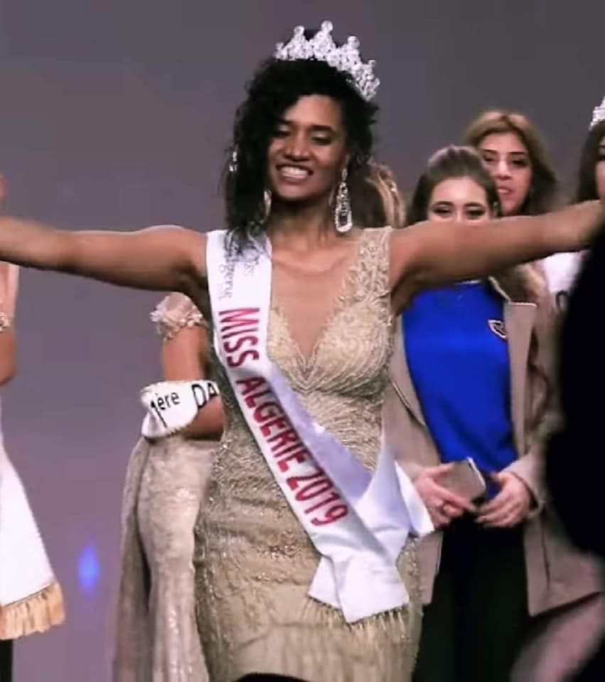 jenanmoussa's tweet photo. This beautiful lady is Khadija Ben Hamou. She was just chosen Miss Algeria 2019.

Sadly some users on Arab twitter are attacking &amp; insulting her because she is a woman of color.

You are stunning Khadija.

Let's show her some love. ❤

#خديجة_بن_حمو

@akhbar https://t.co/SwwlznQZi7