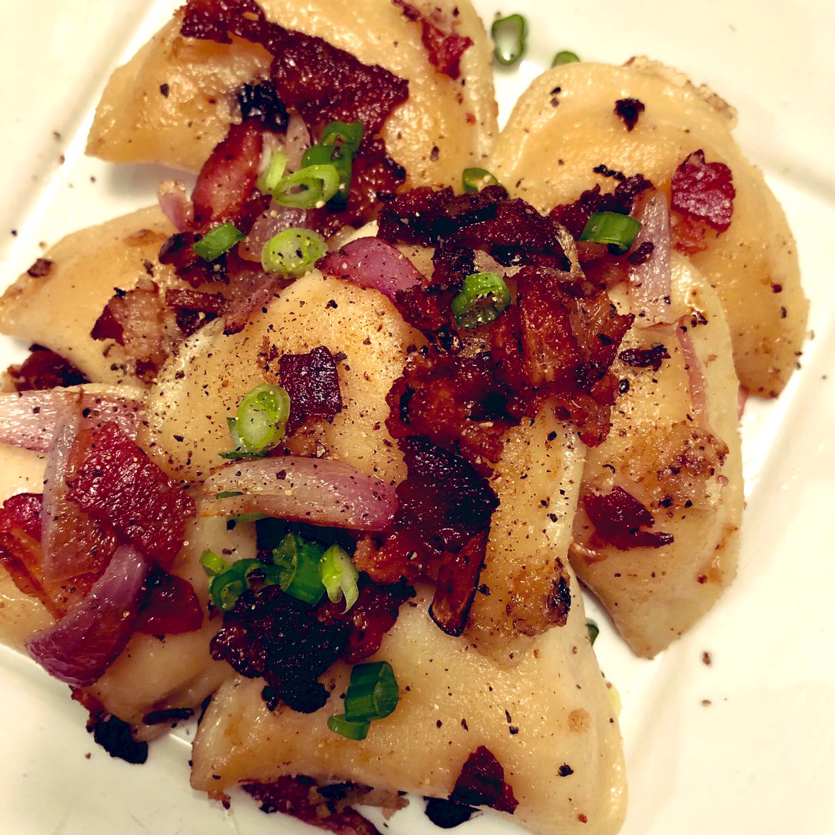 Chynableu's tweet photo. Pan fried perogies filled with potatoe/cheddar cheese and crispy bacon/red onions 💛 https://t.co/gw4E05cUpk