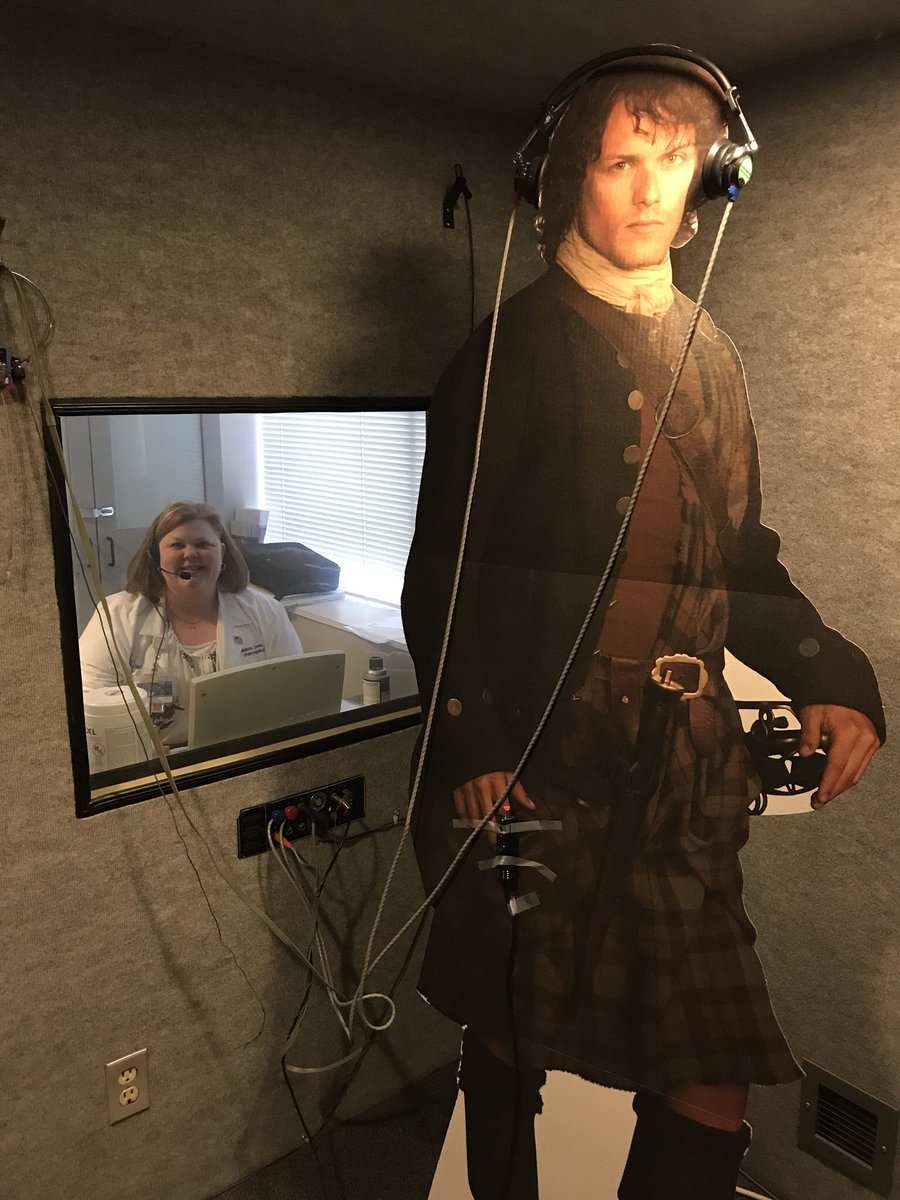 mlowe2020's tweet photo. So I’m new to this twitter thing but felt I had to share this...what do you do when someone gives you a life size cut out of Outlander’s Jamie Fraser and you are an Audiologist? You give him a hearing test of course! #Hearinghealthisimportant @SamHeughan @Outlander_STARZ https://t.co/Tw14CZbaRF