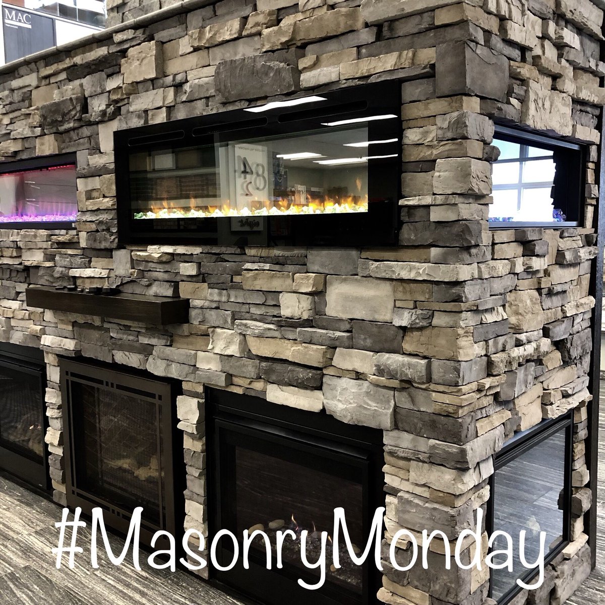 It’s blowing snow outside but that won’t stop us from featuring some interior masonry work! Shown here is our new Shadowledge Ironwood #masonrymonday #timberstone #interiordesign #fireplaces