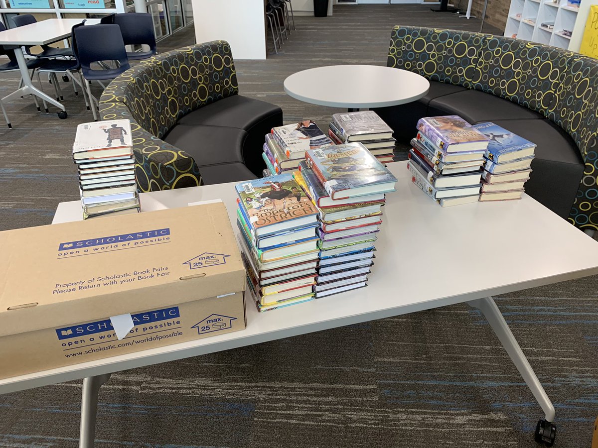 MrsQ_HMS's tweet photo. Genrefication Day 1 - see those matching spines behind me?! Messy process, but it will be worth it! #gcisdlib #thebroncoway Iโll let you know what the readers think. #genrefy #bookshift #happybrowsing https://t.co/623Vd7lHTr