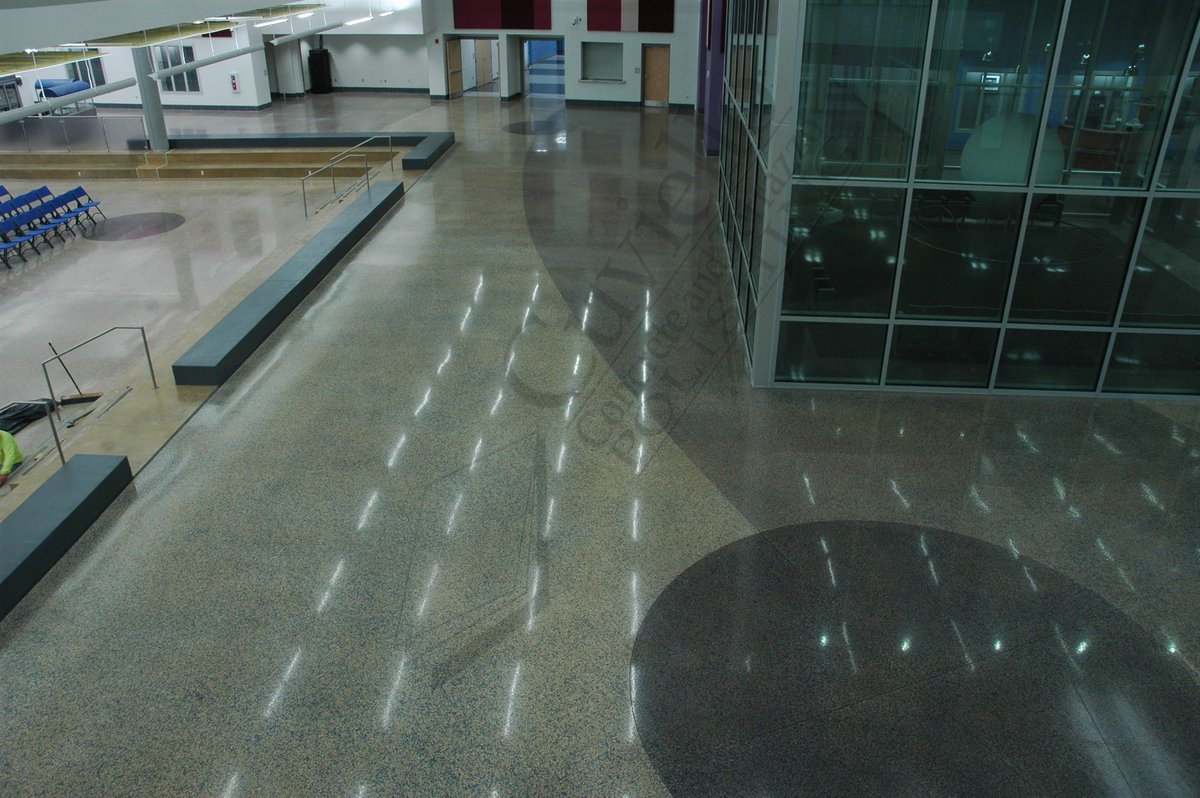 CuvielloConcret's tweet photo. St. Charles High School in Waldorf, MD. The cast in place contractor seeded glass into the surface. Cuviello was contracted a year after to expose the glass, cut design and stain. #architecturalconcreteflooring #craftsmanship #polishedconcrete @RetroPlate @Ameripolish @JointsFill https://t.co/d7mD64WYd4