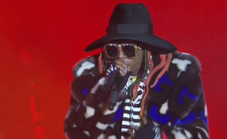 Why does Lil Wayne look like Scooby Doo trying to sneak on the plane to Spooky Island? #lilwayne #imaginedragons #NationalChampionship