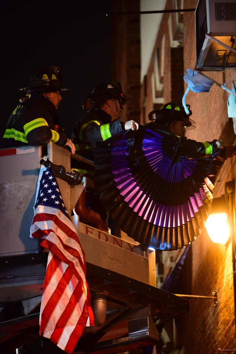FDNY's tweet photo. #FDNY Firefighters Mike Keane, Paul Peterson, Kevin Lynch, and Edward Purpora drape purple and black bunting on the exterior of #Engine257 #Ladder170 and #Battalion58 where Firefighter Steven H. Pollard served. Read more: https://t.co/Wrst6JBdIv https://t.co/wSaE6gAaCM