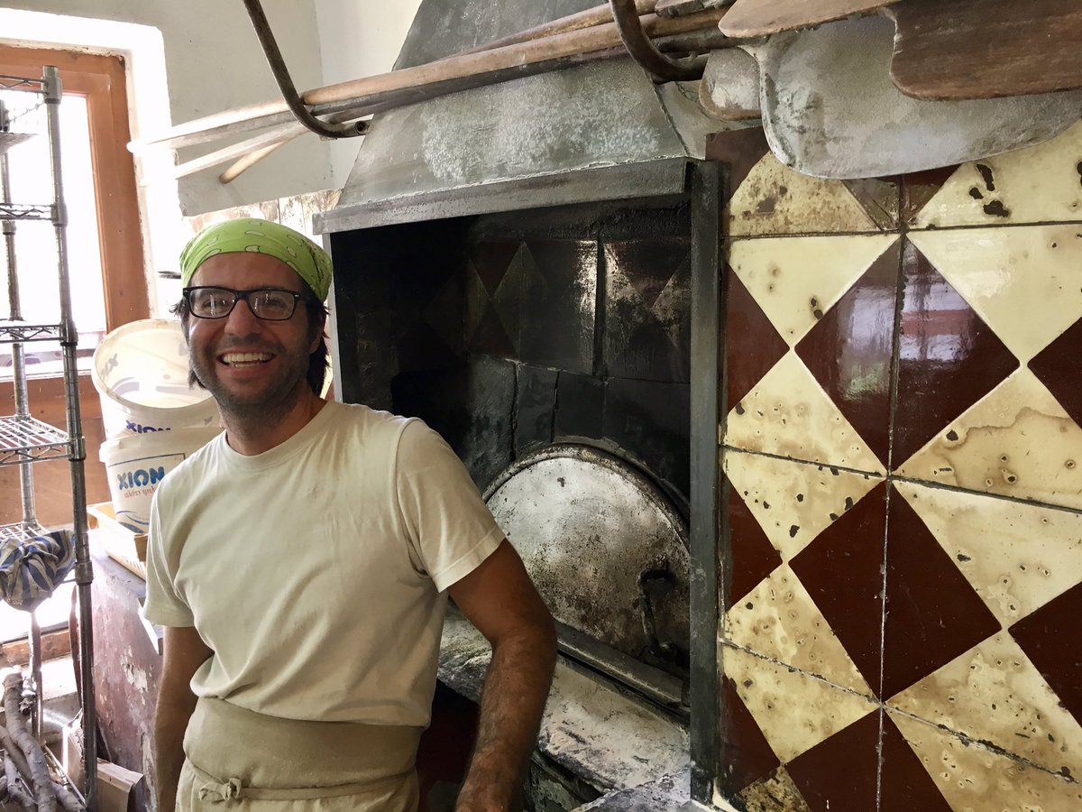 A true #greekdinner includes #fresh #greek #bread from a local #bakery. This is Niko, the chill #baker who owns the oldest #wood #fired #oven on #bluezone #ikaria. We’ll have a #baking #class with him on our June  “Genuine Greece” #tour with #chef @amyriolo Details via profile.