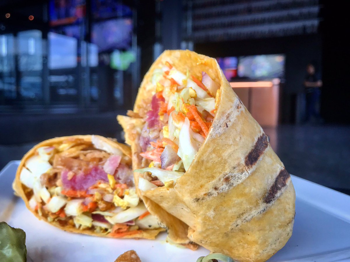 Featuring a seared tuna wrap with Ahi Tuna, wasabi aioli, wontons and cabbage. #itsawrap #ahituna