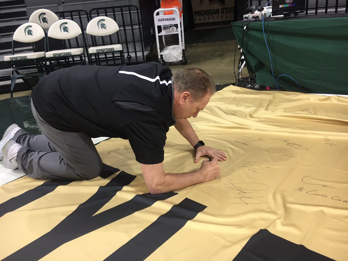 MSU_Basketball's tweet photo. In remembrance of Tyler Trent, Michigan State will have a banner on the concourse outside of section 109 for fans to sign pregame. Before shootaround Coach Izzo and the team were the first to sign the banner. #TylerStrong https://t.co/ddeud8pRyu