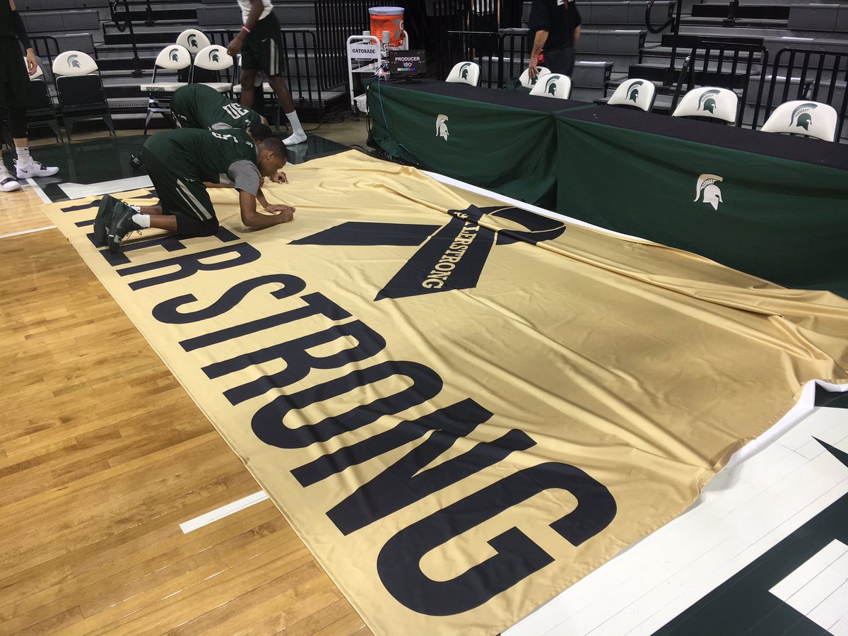 MSU_Basketball's tweet photo. In remembrance of Tyler Trent, Michigan State will have a banner on the concourse outside of section 109 for fans to sign pregame. Before shootaround Coach Izzo and the team were the first to sign the banner. #TylerStrong https://t.co/ddeud8pRyu