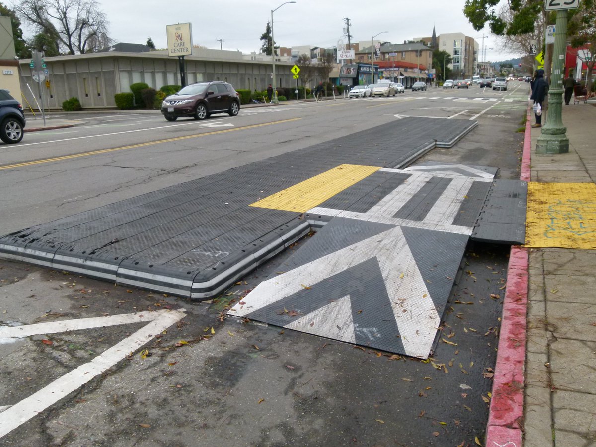 Reviving this thread because I have a few more bike lane measurements to add. First, the bolt-on bus platforms on Telegraph in Oakland. The first part is 6'7" from curb to platform, but the ramp is only 4'8". The narrower part up ahead is 5'6" wide.