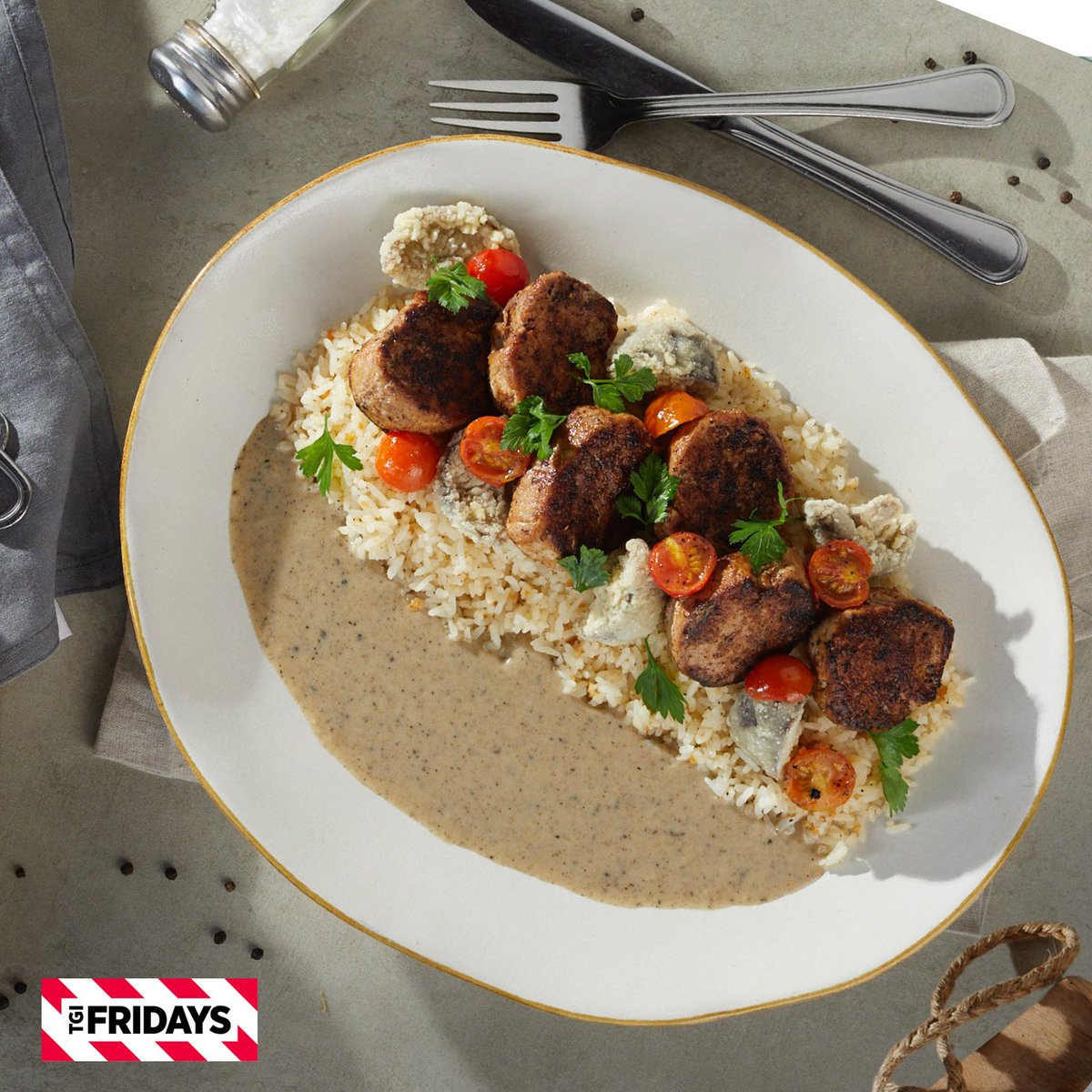 TGIFridaysPH's tweet photo. Get everyone into the festive mood with our Pork Medallions. Make sure to scoop up some garlic rice and truffle cream sauce with that. #TGIFridaysPH https://t.co/TdnxDHxFgp