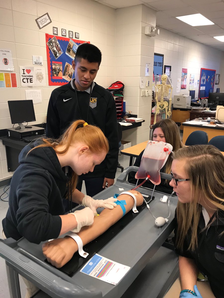 Therapeutic Services student learning to draw blood. PCT students teaching the skill! So proud of my Health Science Students! #googasgold