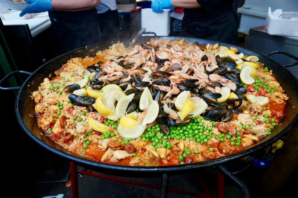 SusosFork's tweet photo. At London's Borough Market, they call this paella. It's pretty much rice with everything! Is it a Spanish classic when it's made with chicken, chorizo and seafood and a lot of other stuff? @boroughmarket #London https://t.co/Em6yjPzvK6