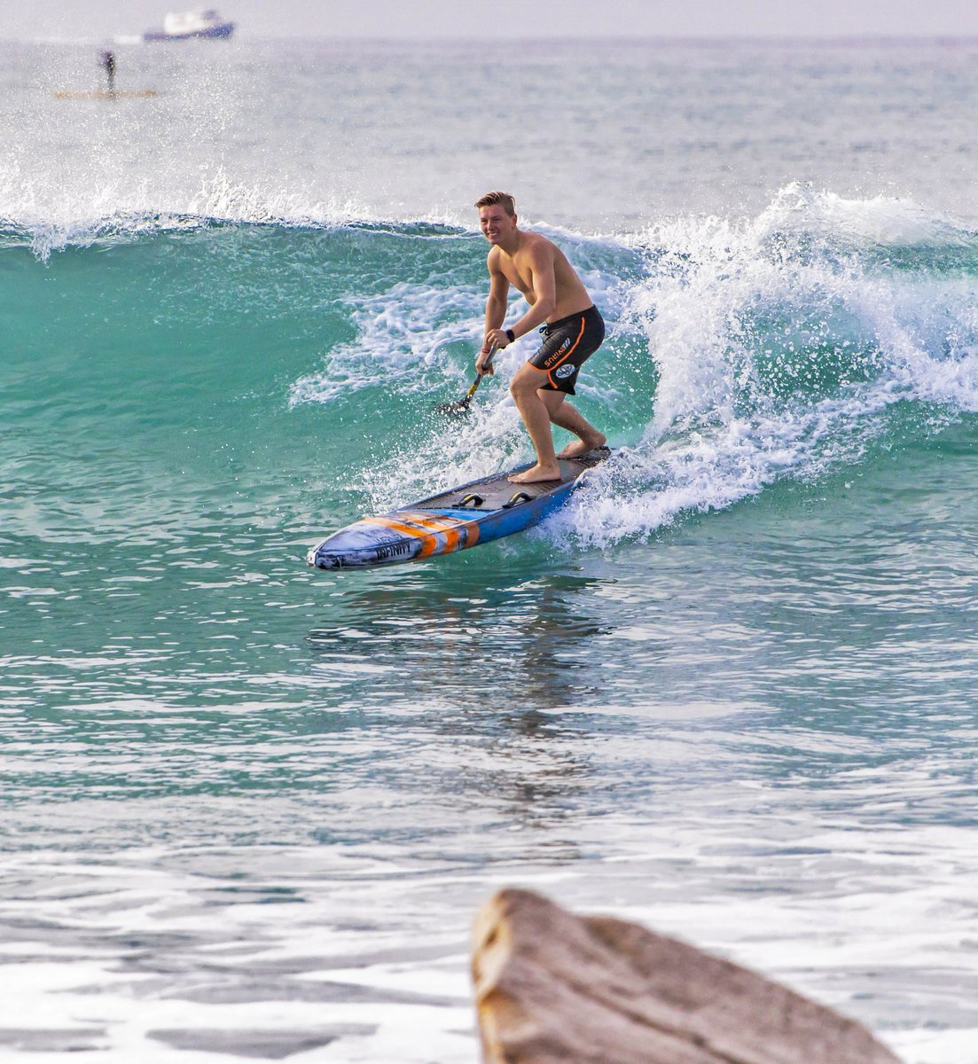 Tyler Bashor, team athlete, playing in the surf at Doheny State beach in California. 📷 Rand Morino