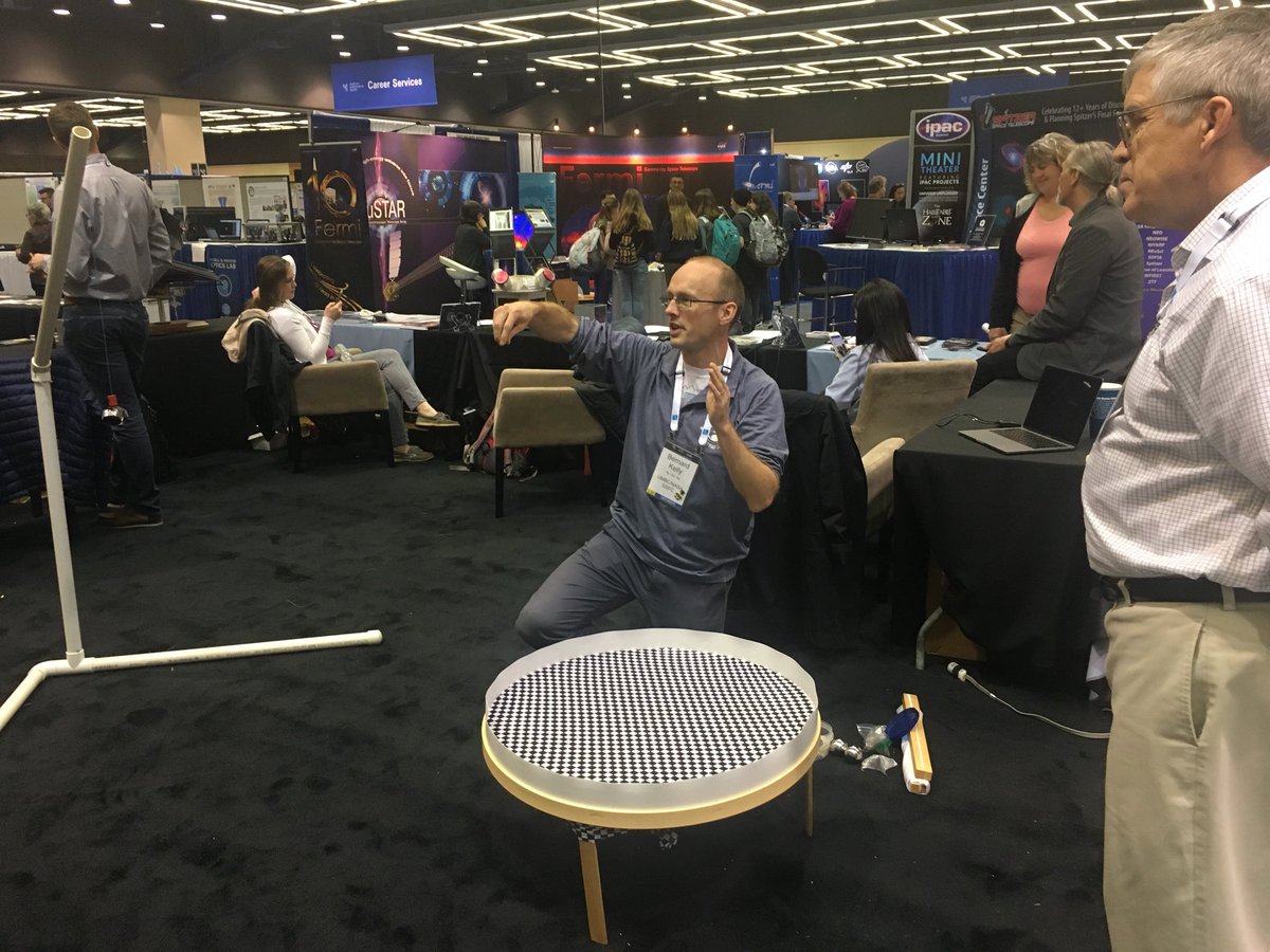 Bernard Kelly showing  curved space time and a gravitational wave inspiral to high schoolers! <a href="/LISACommunity/">LISA Mission</a> #gravitationalWave #aas233