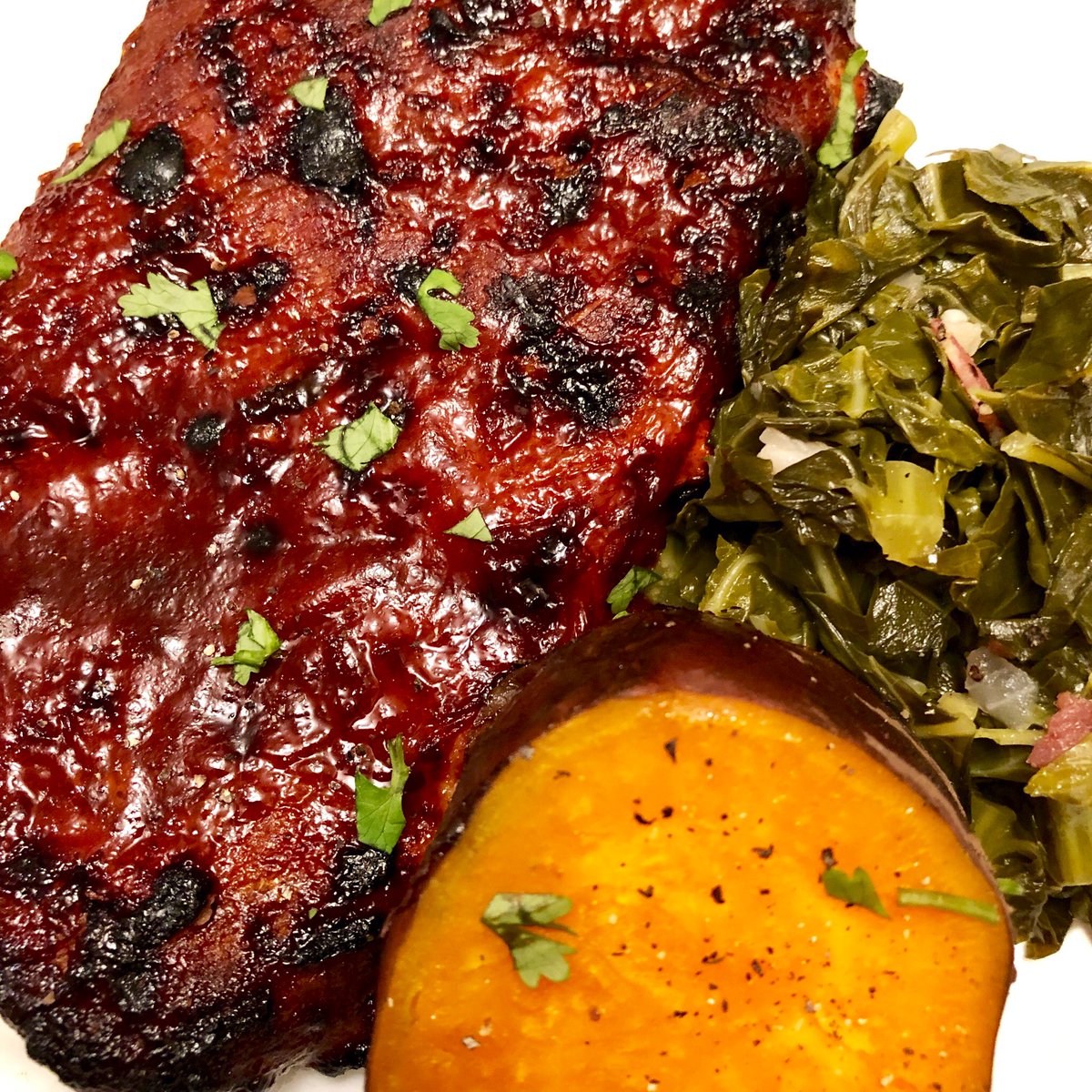 Chynableu's tweet photo. Sticky pork ribs with sour cherry chipotle glaze , sautéed collard green with bacon and steamed sweet potatoes 💛 https://t.co/UI9z4rPcly