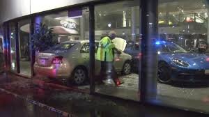 Security officer detains man who intentionally crashed into Porsche dealership