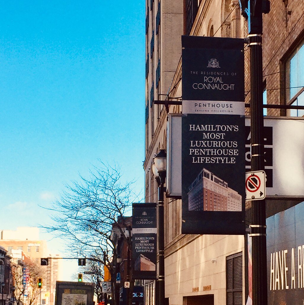 reprodux's tweet photo. Pole banners: recently made for @RoyalConnaught_ now inviting you to live atop one of downtown Hamilton’s heritage icons. #HamOnt https://t.co/Xi8Ge23UJN