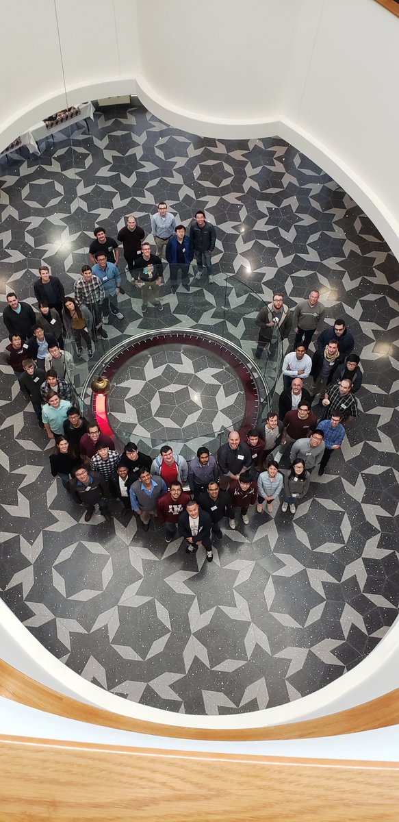Attendees at the 2019 JETSCAPE Winter School and Workshop, gathered around the Foucault pendulum at the Mitchell Institute at Texas A&amp;M University.