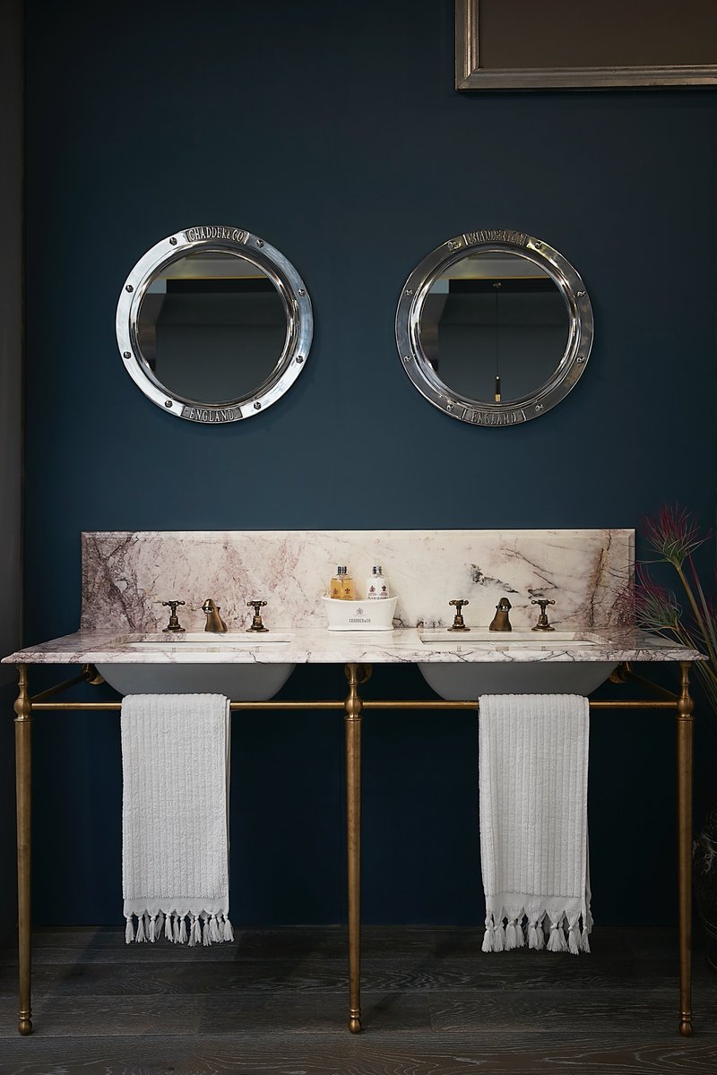 Simple, elegant, timeless. Our Savoy Double Basin with brushed brass frame, bespoke lilac marble top and Aged Brass taps. Porthole mirrors above. 
#bathroom #interiordesign #bathroombasin #sink #interiorinspiration #basin #vanityunit #luxurybathroom #bathroommirror #porthole #tap