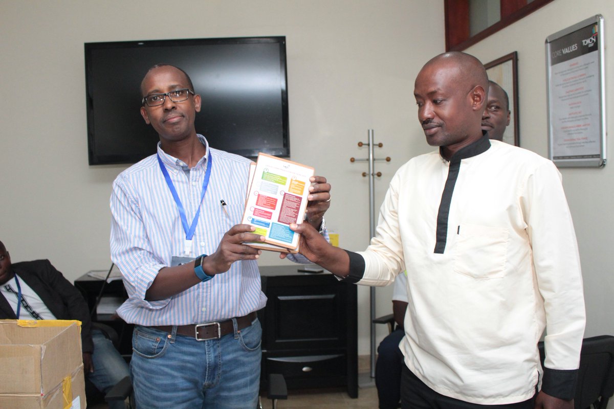 tomosigroup's tweet photo. @tomosigroup's @Odrek_Rwabwogo presents gifts of customised 2019 diaries with inscriptions of the Group's new commitments to the different Unit Heads from @Terp_Media, @gmsecurityltd, @tomosizfarm, @tomosiconstrn, @tomosifoundn, @corbanspaces &amp; KaaroFM at the Tomosi Business Park https://t.co/2LF1x1rUiM