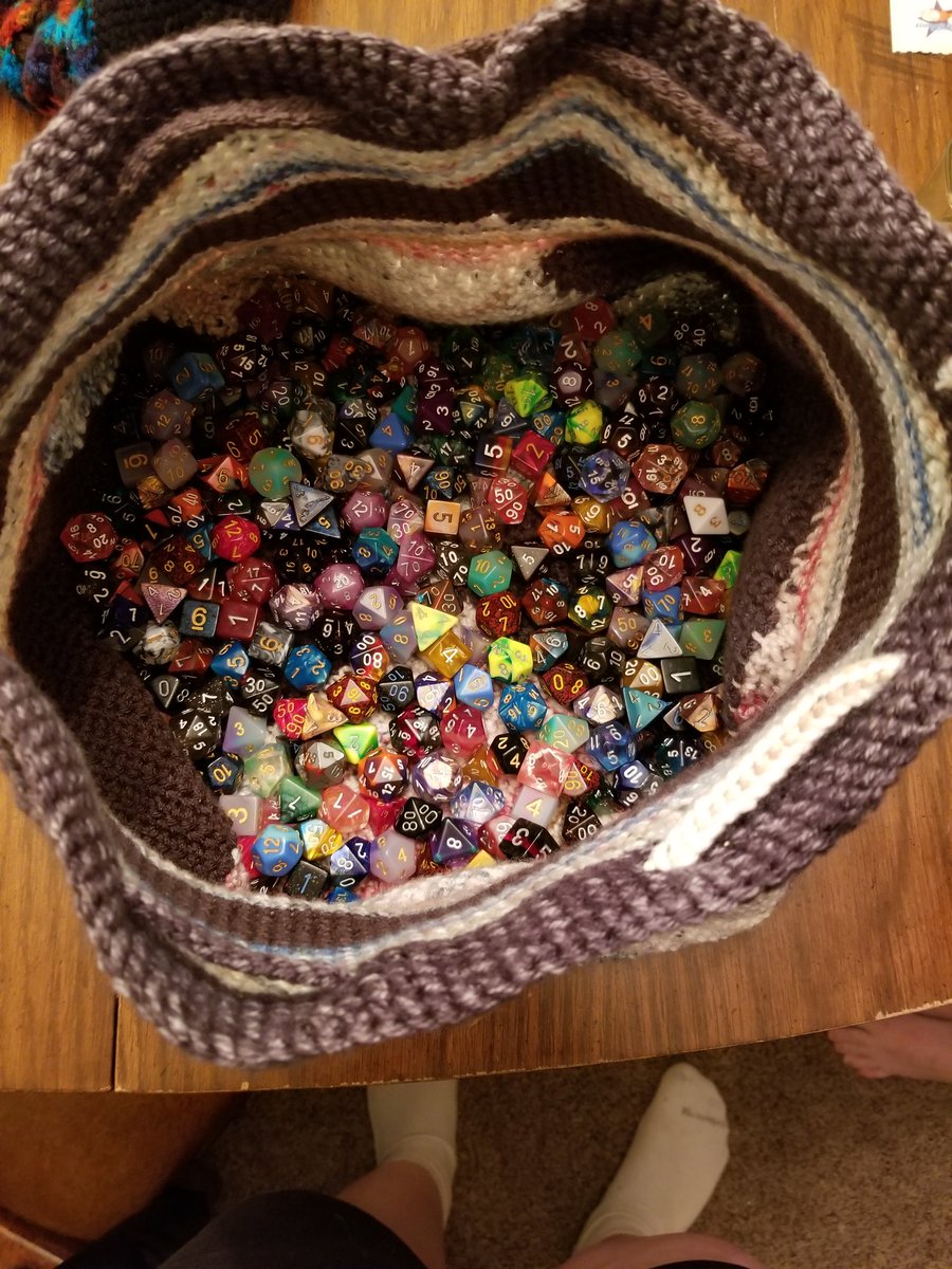 QDerkan's tweet photo. My previous dice bag was bursting at the seams with 38 sets and dropping dice. The new one might be a bit big now 😅 #DnD #crochet #idonthaveadiceproblem #dndbag https://t.co/QRQ7xCrNxd