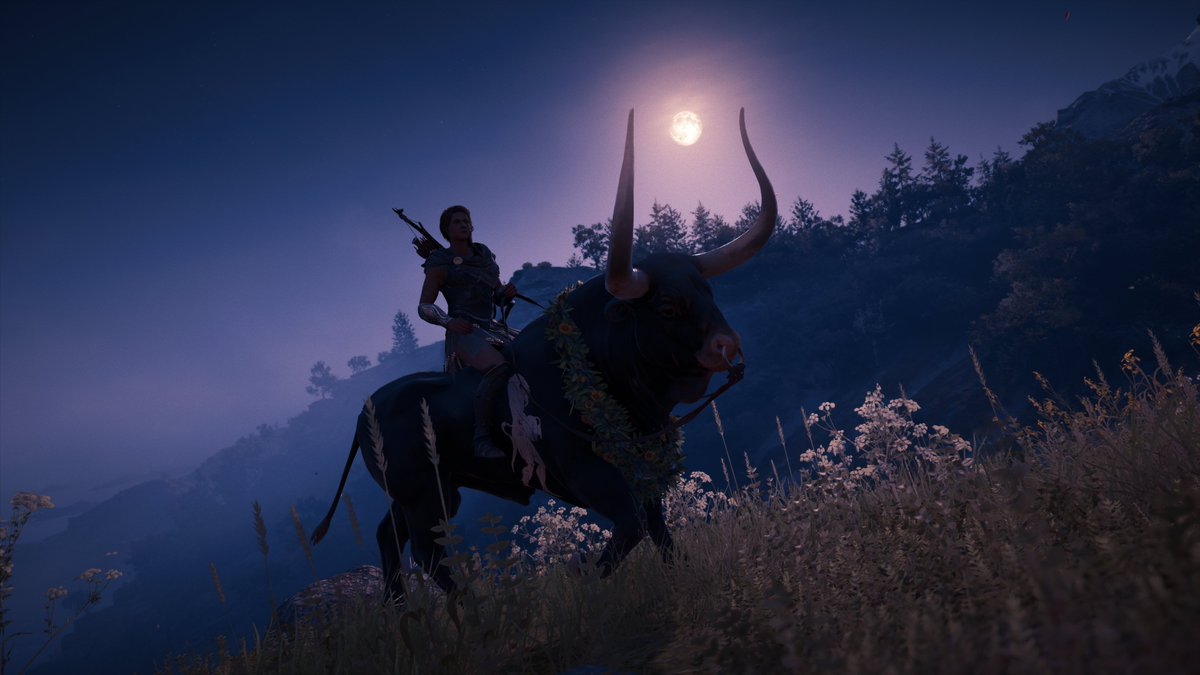 Kassandra rides a bull up a hillside speckled with wildflowers on a cool evening. The bull wears a garland of leaves and flowers, and the moon is framed by his long horns.