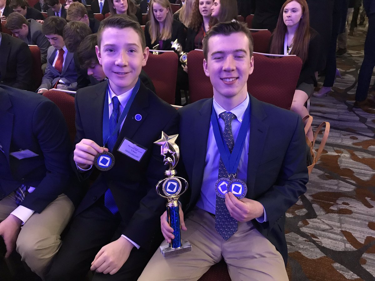 The Boyd Boys share their hardware at DECA! Celebrating Excellence! #proudofyou #WeRMarshfield