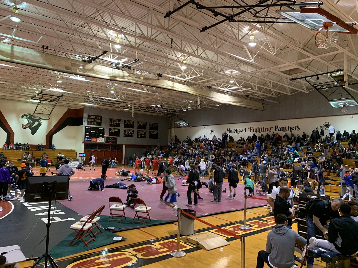 JoyHToms's tweet photo. A few of my favorite things: High school wrestling, huge American flag and Morehead alums coming back to help with the Sarah Wilkes Tournament. Action continues today, 9am. 23 teams from across NC and VA. #pantherpride @SeWrestle #moreheadwrestling https://t.co/MqQfT8oqVH