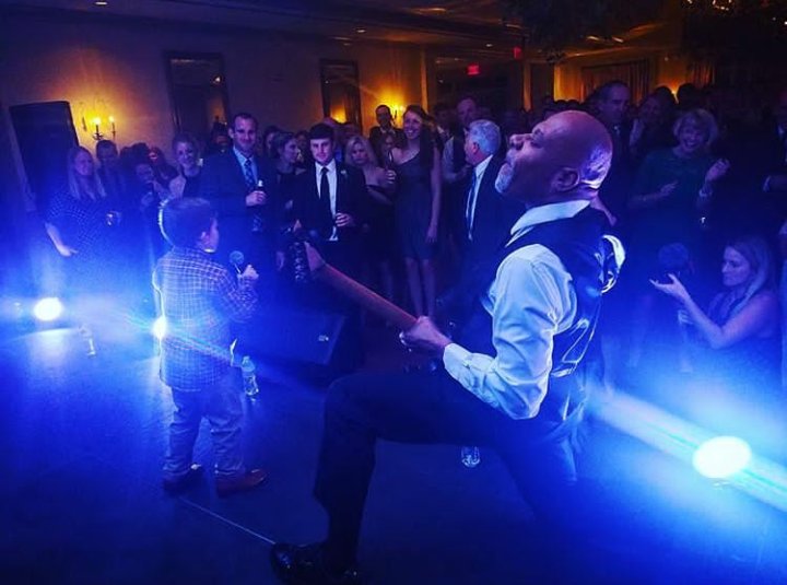 Me and a little friend posing down at a wedding reception...Lol.... He definitely won!