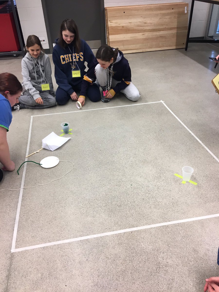 UWEngOutreach's tweet photo. Design challenge time! Task: design something to pick up objects from one cup and carry it over to the other without entering the containment zone or spilling any of the contents..#bringiton #uwengineering #GirlsInSTEM #girlguides #stemeducation #kwawesome https://t.co/HtcnGpAFA9