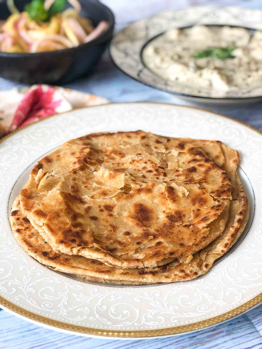 Curry in a Naan Warqi Paratha Recipe: Warqi Paratha Recipe is a delicious flaky paratha. Warqi means layers, the dough is flattened and folded multiple times, each times brushed generously with butter and dusted with flour to help those layers stand out… dlvr.it/QwZ2KQ
