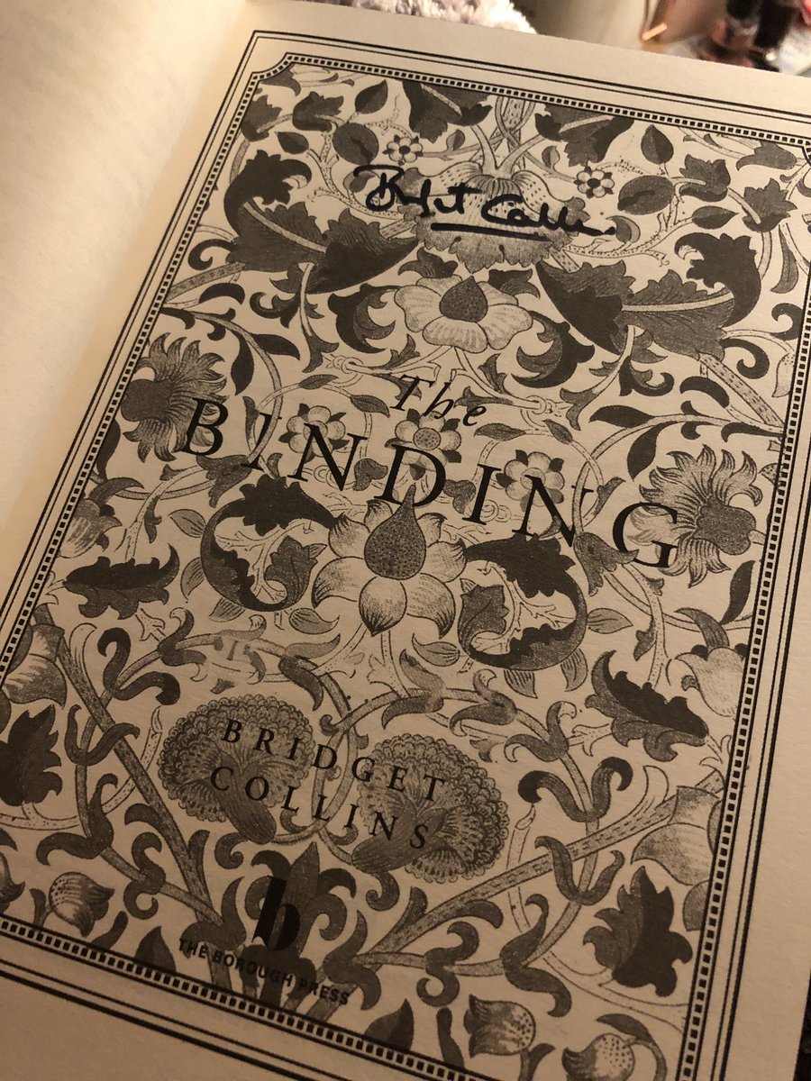 I can’t get over what a work of art this book is. Purple-edged pages AND signed by the author 💜 #thebinding #bridgetcollins