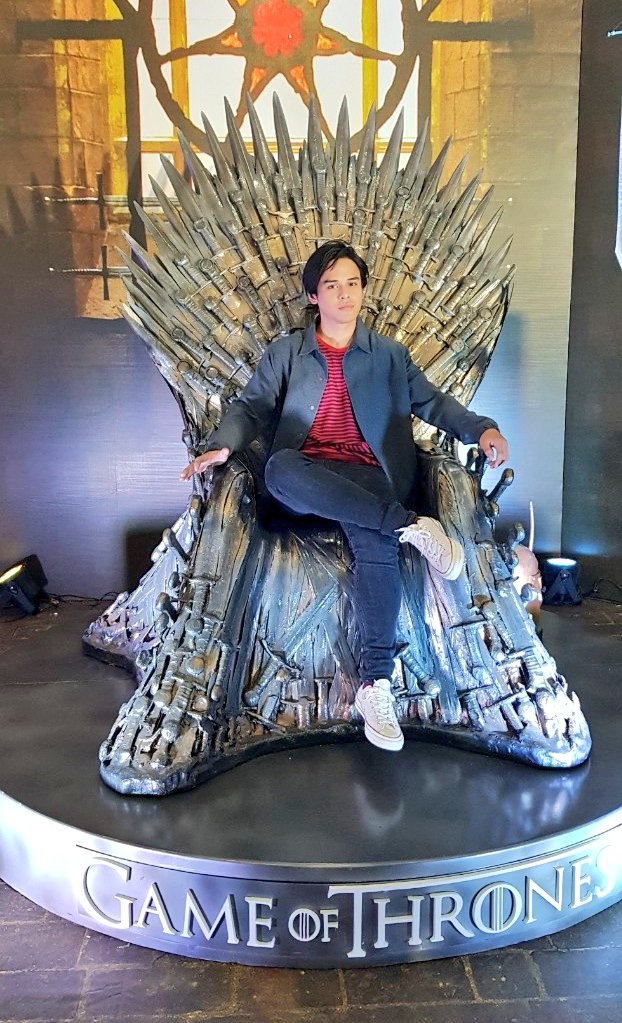ABSCBNpr's tweet photo. @TheKhalilRamos sits royally as he gets to experience the Iron Throne at the #SKYAlive event. #GOT #GOTonSKY https://t.co/oS46wFmR9z