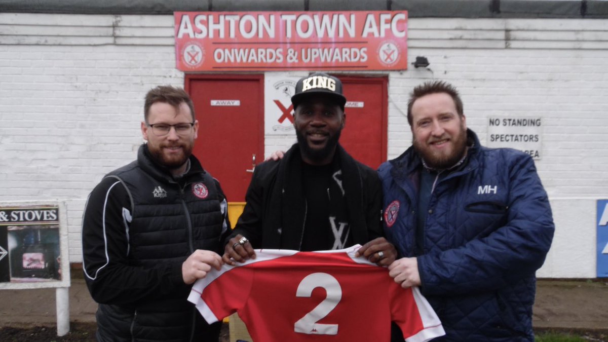 It’s happening <a href="/pascalchimbond1/">chimbonda pascal</a> has arrived @ashtontownafc &amp; is pictured with Chairman <a href="/northernpromise/">Mark Hayes</a> &amp; first team manager <a href="/davedemps13/">David Dempsey</a> with the No2 shirt he will wear versus <a href="/BacupBoro/">Bacup Borough FC</a>  in this afternoon’s <a href="/nwcfl/">The NWCFL ⚽️</a> game 3pm KO ⚽️🔴⚪️ <a href="/NonLeaguePaper/">The Non-League Paper</a> <a href="/WigToday/">WiganToday</a> <a href="/SkySportsNews/">Sky Sports News</a>