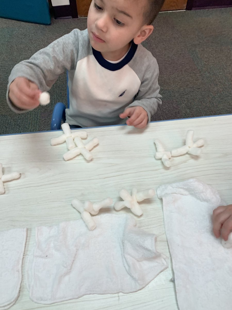 Who knew shoe box peanuts could make for “snow” building fun!