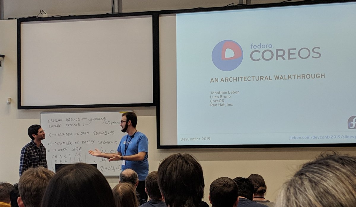 ashcrow's tweet image. Jonathan Lebon and @lucabruno presentation #Fedora #CoreOS architecture at @devconf_cz! #devconfcz #DevConf2019