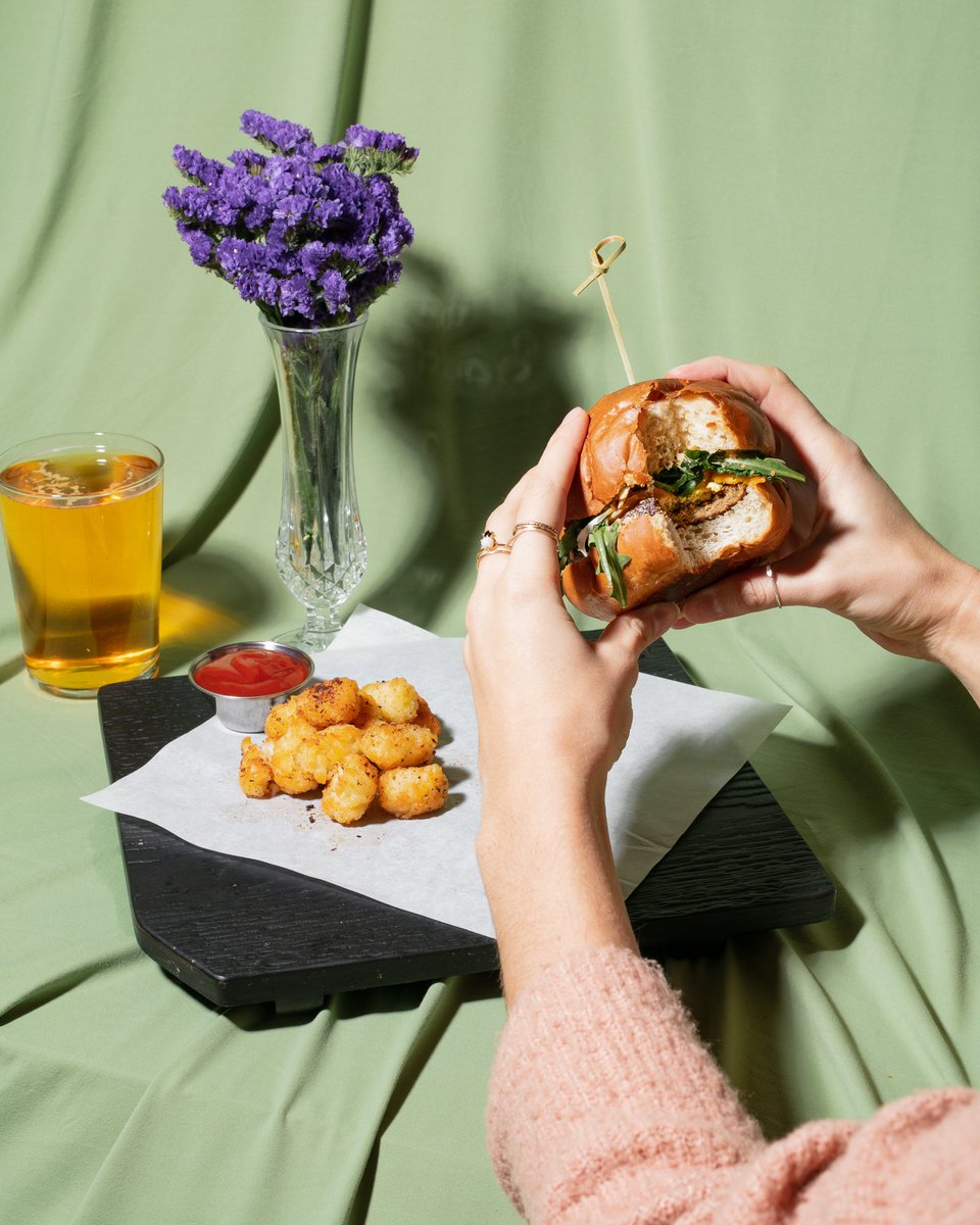 BITE INTO BRUNCH | Introducing the SUNNY SIDE Breakfast Sandwich: Tofu Scramble, Cheddar Cheese, Chorizo Patty, Arugula, Chipotle Aioli, and Oven Dried Tomatoes on our House-Baked Brioche Bun. Served with a side of Cajun Tater Tots.
.
Available Sat + Sun from 10:30am to 2:30pm!