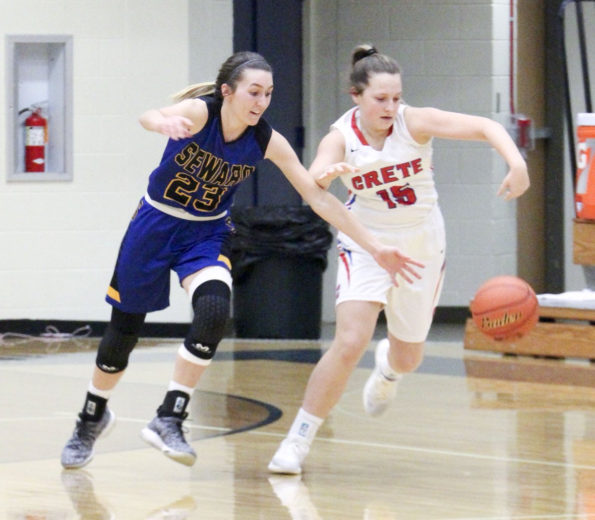 SCIStephanie's tweet photo. GB: @bailee14baack of @SewardBlueJays tries to complete the steal against Crete tonight in the conference championship game. #sewardjays #pickingpockets https://t.co/w0qkNly2Oz